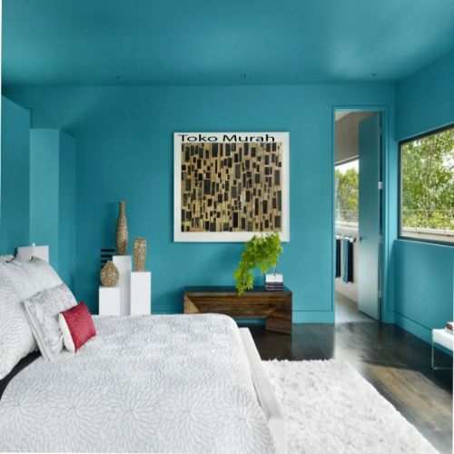 Bright blue room with modern artwork