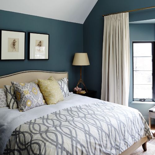 Dark blue walls and patterned pillows
