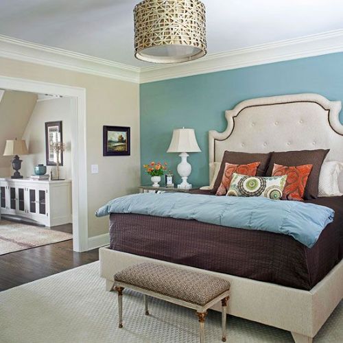 Soft green walls with cozy bedding